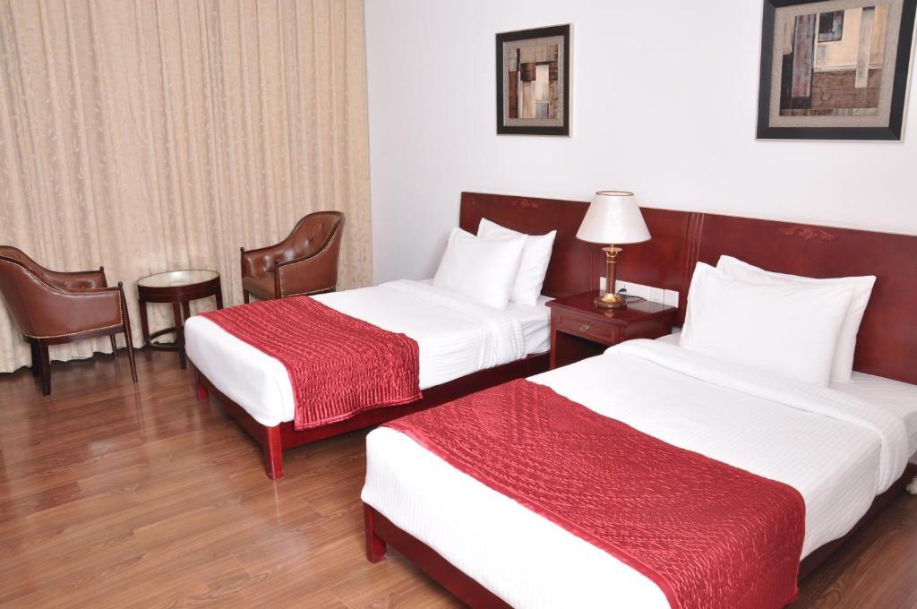 Lilywhite Hotel Neu-Delhi Zimmer foto